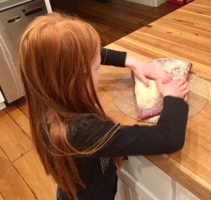 My daughter rubbing in the 3 salts to the brisket.  She is the best helper!!